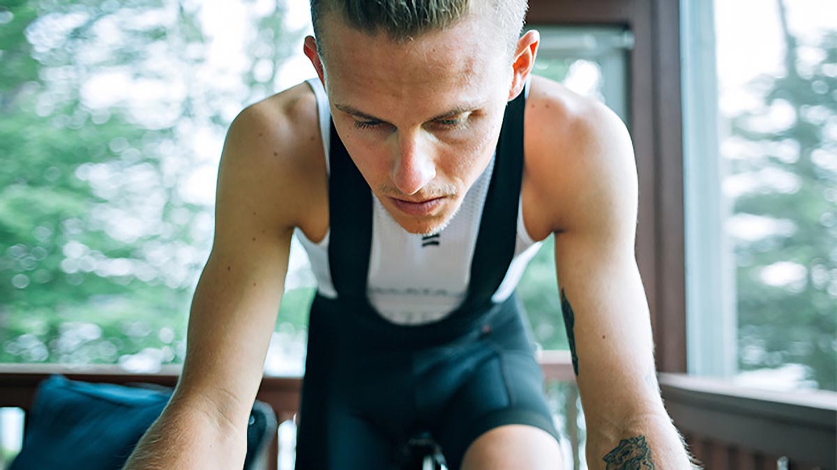 11290 3 Trainer Workouts To Beat The Holiday Madness Tight Photo Of A Male Cyclist On An Indoor Trainer