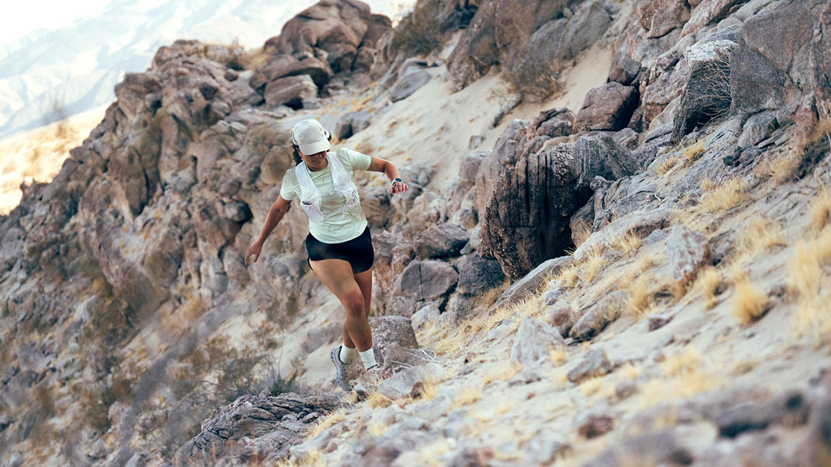 250429 Cwhite 001911 A Woman Trail Running On Rugged Desert Terrain