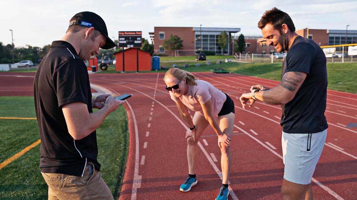 Athletes Skip Workouts 22264 A Coach With A Female And Male Runner After A Workout At A Track
