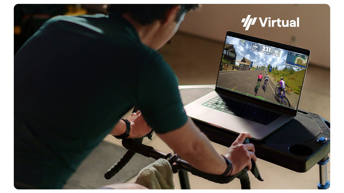 Male Cyclist On Trainer With Trainingpeaks Virtual On Laptop